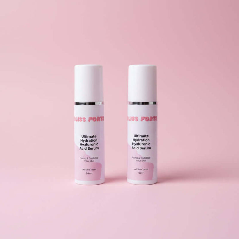 Two bottles of 'Bliss Forte' serum on a reflective surface with a purple background